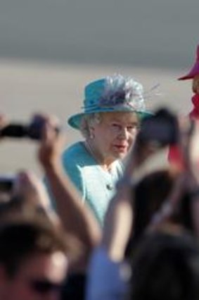 Governor-General Quentin Bryce accompanies the Queen.
