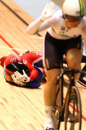 Earlier this year ... Victoria Pendleton crashes in the women's sprint semifinals race against Anna Meares at the 2012 UCI Track Cycling World Championships in Melbourne.