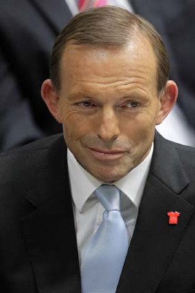 Itching at his tax hair shirt ... Opposition Leader Tony Abbott.