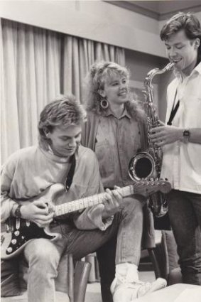 Jason Donovan, Kylie Minogue, and Guy Pearce on the set of <i>Neighbours</i>.