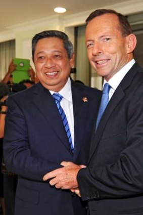 "Peddling a myth to the Australian people"... Julia Gillard attacks Tony Abbott's failure to speak of his controversial tow-back policy with the Indonesian President, Susilo Bambang Yudhoyono.