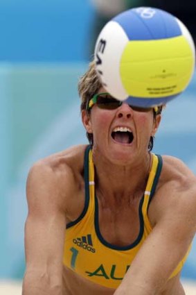 Australia's Natalie Cook lunges for the ball.