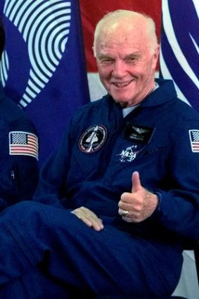 Oldest person to travel in space ... John Glenn, at 77, gives a "thumbs up" to the crowd during a welcome home ceremony at Ellington Field in November 1998, after joining the crew of the space shuttle Discovery for a nine-day mission in space.