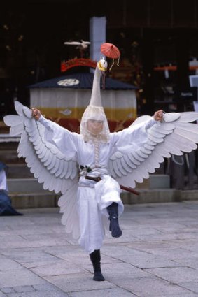 A crane dance performer at Asaka shrine.