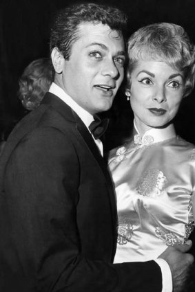 Tony Curtis dances with Janet Leigh at a party in 1961.