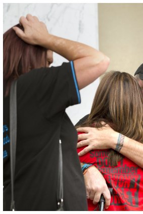 Paul Levey hugs his wife Michele before travelling to Rome.