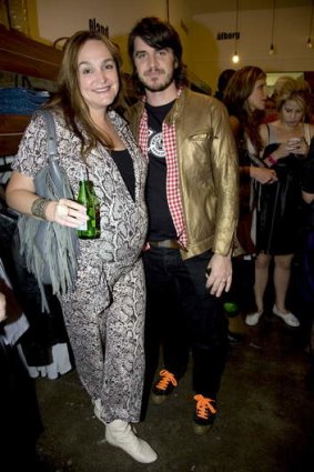 A pregnant Kate Langbroek with husband Peter Lewis.