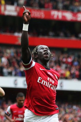 On song: Arsenal's Bacary Sagna celebrates scoring against Stoke City at Emirates Stadium.
