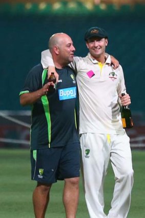 Feeling bubbly: Australian coach Darren Lehmann and skipper Michael Clarke share a midnight champagne moment at the SCG.
