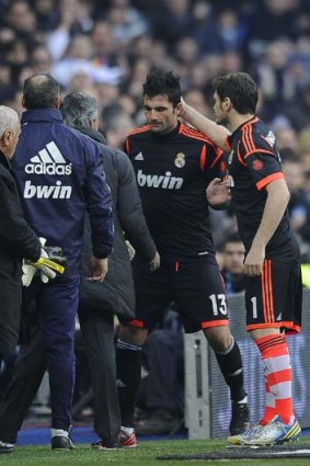 Iker Casillas (right) comforts Real Madrid's starting goalkeeper Antonio Adan (second right) after Adan was sent off.