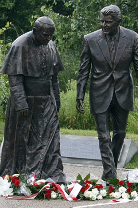 Statue of Pope John Paul II (left), and former US president Ronald Reagan.
