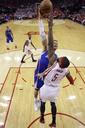Zero gravity: Los Angeles Clippers forward Blake Griffin scores over Houston Rockets rival Josh Smith.