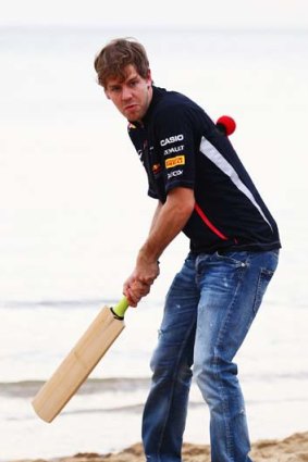 Middles it ... Sebastian Vettel puts away a rank full toss from his Red Bull team mate.