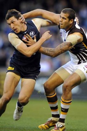 Lance Franklin and Michael Jamison do battle in last year's clash between the Hawks and the Blues.