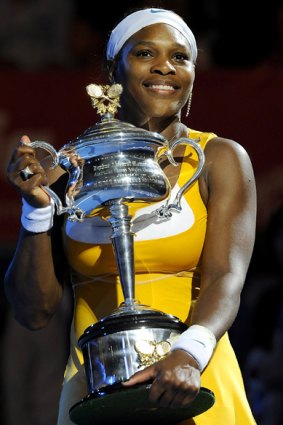 Spoils of victory ... Serena Williams poses with her trophy.