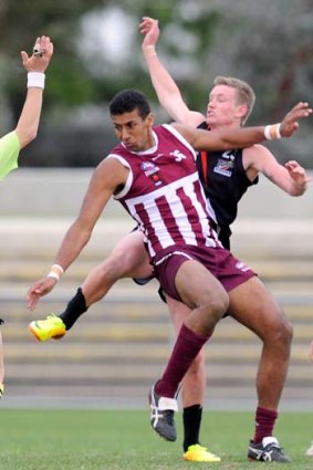 Like father, like son? Archie Smith playing for Queensland on Thursday.