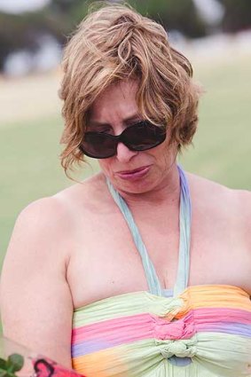 Rosie Batty reads messages left by well-wishers after the death of her son Luke at a Tyabb oval.