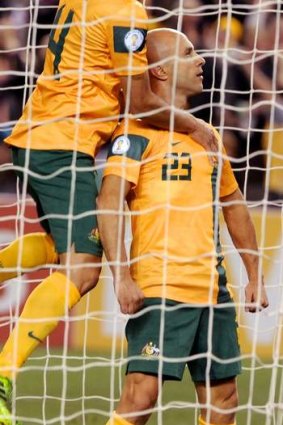 In hot water: Australia's Mark Bresciano could miss the 2014 World Cup in Brazil.