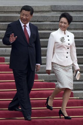 'Iron fist': President Xi Jinping and his wife Peng Liyuan.