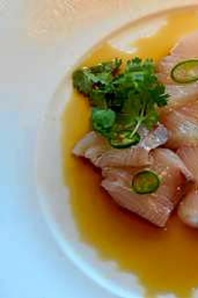 Yellow tail sashimi with jalapeno.
