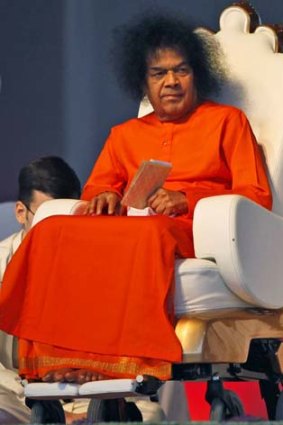 Indian spiritual leader Satya Sai Baba looks on at a function to meet his devotees in New Delhi in April last year.