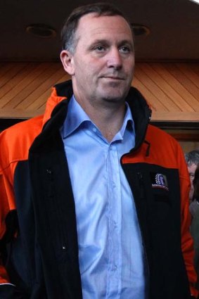 New Zealand Prime Minister John Key arrives at a press conference during the mine crisis.