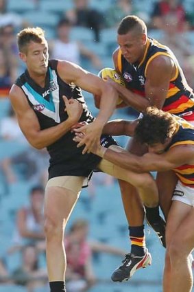 Cam Ellis-Yolmen of Adelaide grabs a mark during the game against Port Adelaide.