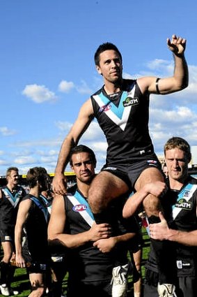 Troy Chaplin, pictured celebrating his 100th game in 2010, could be off to Richmond.
