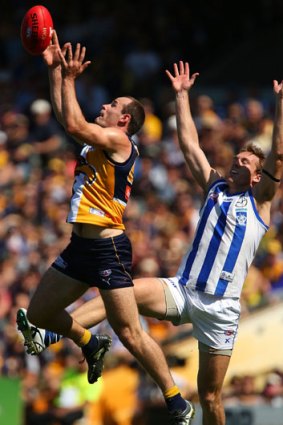 Shannon Hurn flies for a mark.