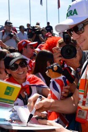 Force India driver Nico Hulkenberg greets fans in Melbourne.