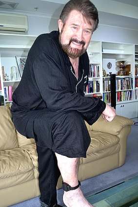 Broadcaster Derryn Hinch shows his ankle bracelet as he prepares to return to the airwaves after a five-month, court-imposed absence.