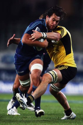Steven Luatua of the Blues charges forward.