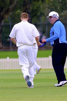 Heads up: Umpire Karl Wentzel in a helmet.