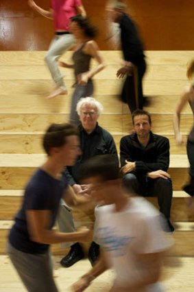 Eye of the storm: Victorian Opera music director Richard Gill and choreographer Gideon Obarzanek amid the riotous <i>Assembly</i> cast.