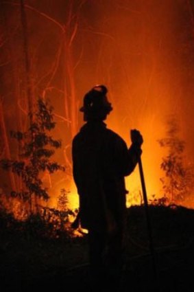 A firefighter battles a blaze from earlier this month.