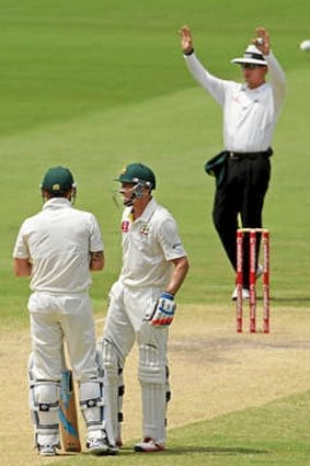 Six more ... Michael Clarke (L) looks on with Michael Hussey after hitting another six  off Imran Tahir.