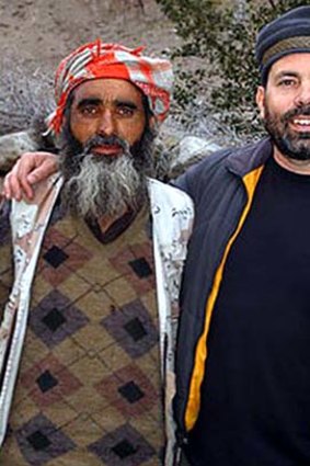 David Oliver Relin with a Pakistani man.