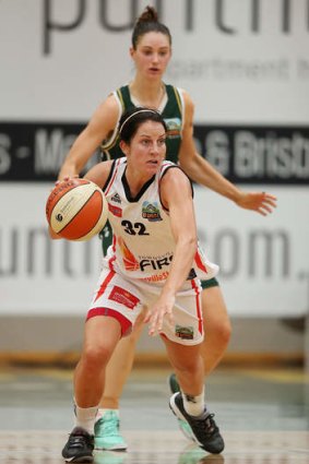 Micaela Cocks of the Townsville Fire runs with the ball during the WNBL Preliminary Final match against the Dandenong Rangers