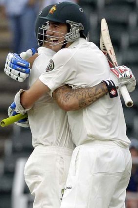 Passed the test ... Pat Cummins, right, celebrates with teammate Mitchell Johnson.