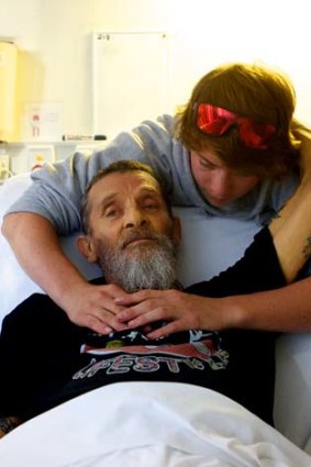 Barry Wilson is comforted in hospital.