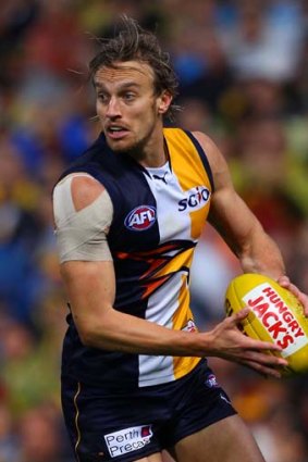 Mark Nicoski looks for a teammate to pass the ball to during the round 24 match against Adelaide.