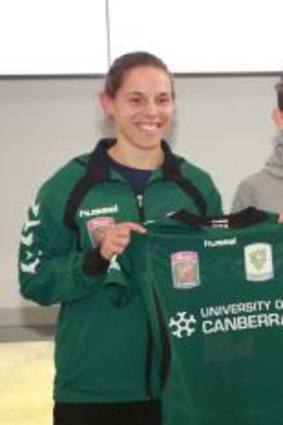 Canberra United players show off their new playing strip, fluoro green. Players l-r Nicole Begg, Ashleigh Sykes, Catherine Brown.