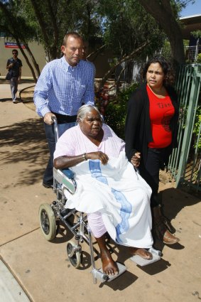 At Alice Springs Hospital ... Mr Abbott with dialysis patient Nora Ward.