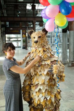 Touching up: Costume designer Clare Britton with the bear from <i>The Piper</i>.