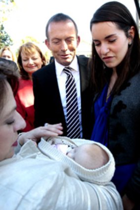 Tony Abbott and his daughter Louise say 'hello' to Liberal MP Sophie Mirabella and her eight-week-old baby, Katerina.