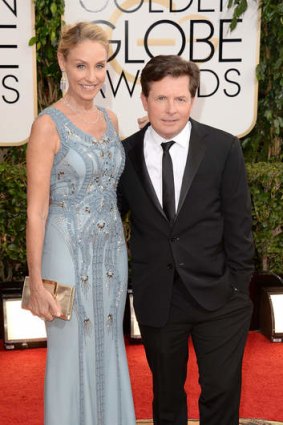 Tracy Pollan (L) and actor Michael J. Fox attend the 71st Annual Golden Globe Awards.