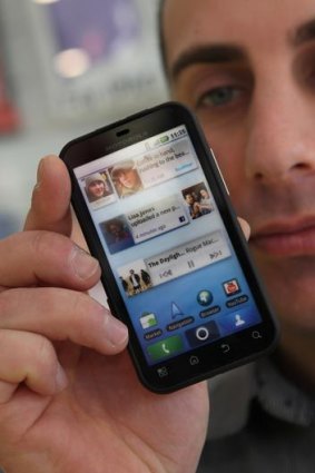 A Motorola Defy smartphone that runs an Android OS.