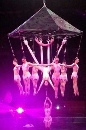 Performers hang form their hair while performing the stunt that went wrong.