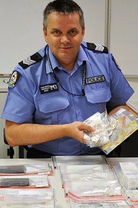 Dunsborough Sergeant Craig Anderson with the items from the police raid.
