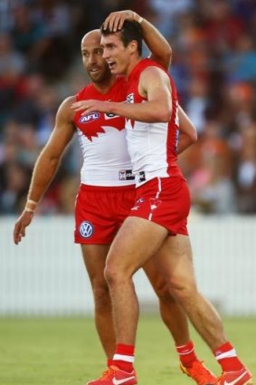 Top shot: Jarrad McVeigh congratulates Dean Towers during a pre-season game. 